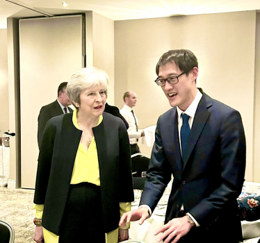 Theresa May with Johnny Luk